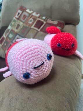 Two crocheted amigurumi turtles pink red green handmade